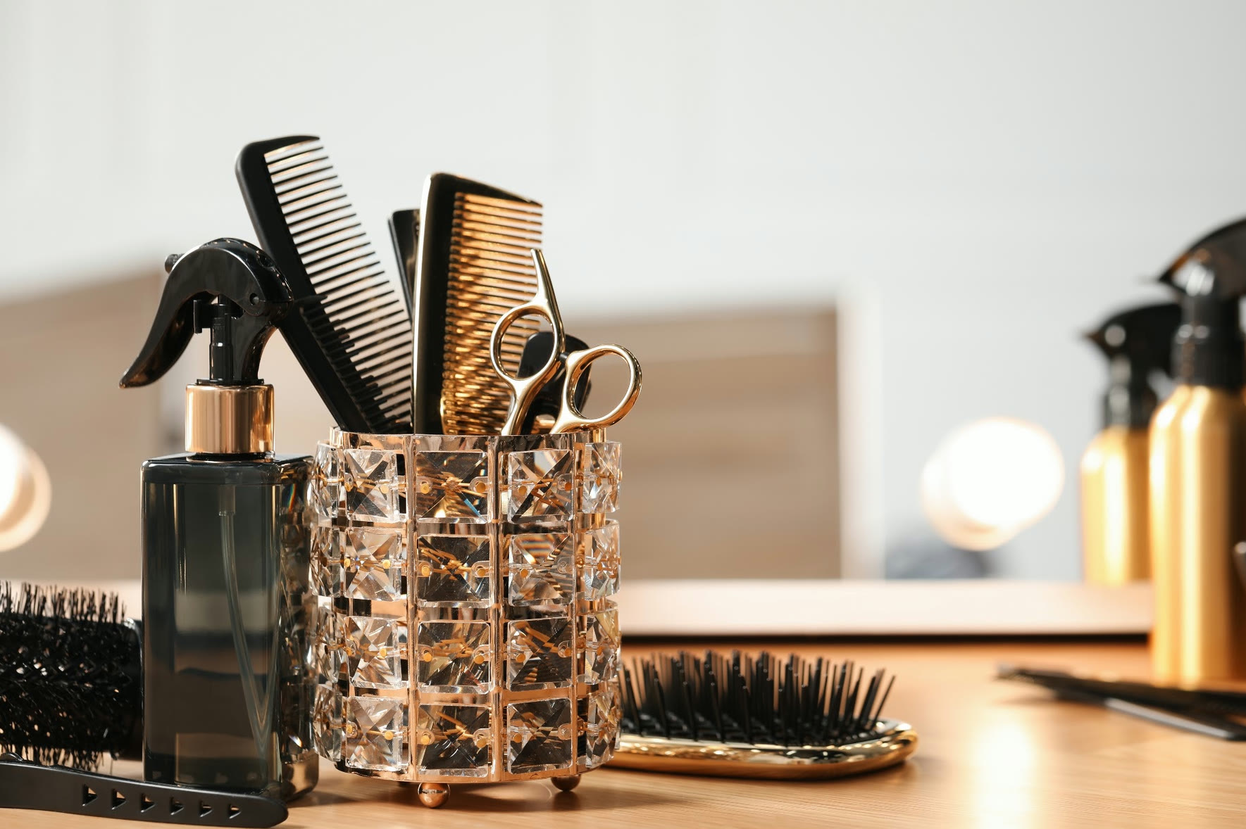 Professional shears, combs and brushes on salon station