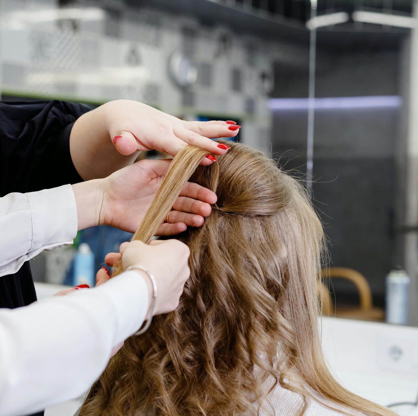 Instructor guiding sectioning and styling technique